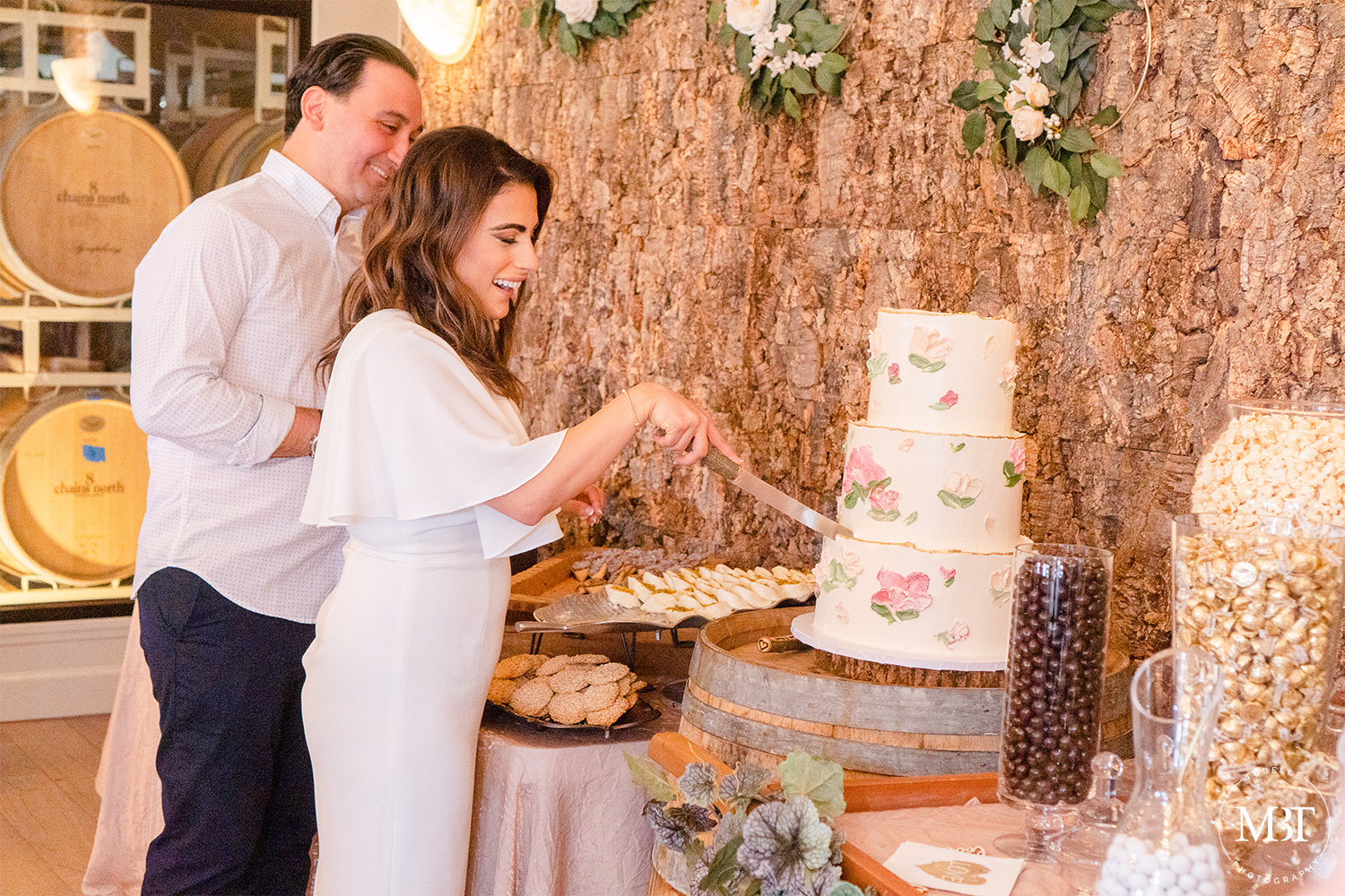 cake cutting by the engaged couple taken in Waterford, Virginia at a bridal shower covered by an event photographer in Northern Virginia