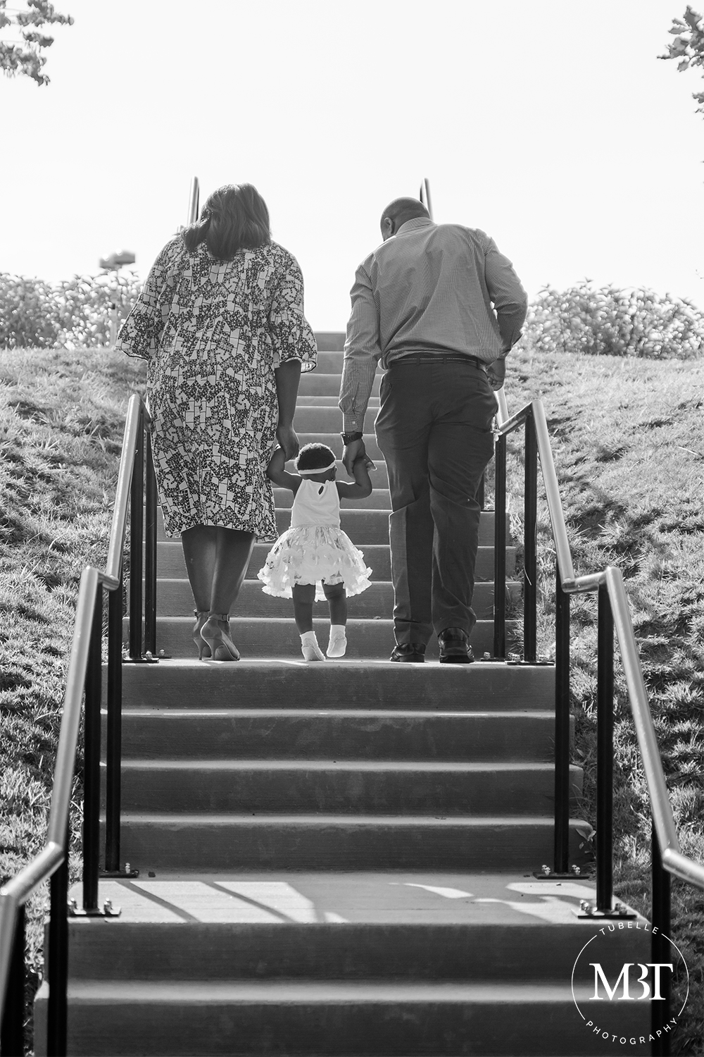 family portrait walking on stairs taken in Loudoun County by a family photographer in Virginia - black and white photo