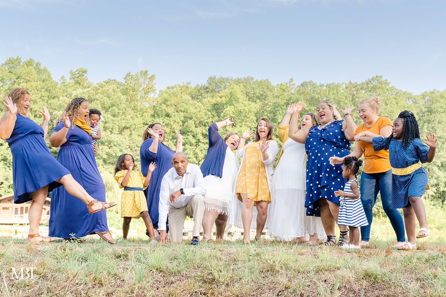 silly pose of extended family, taken in Triangle, Virginia by a Virginia family photographer