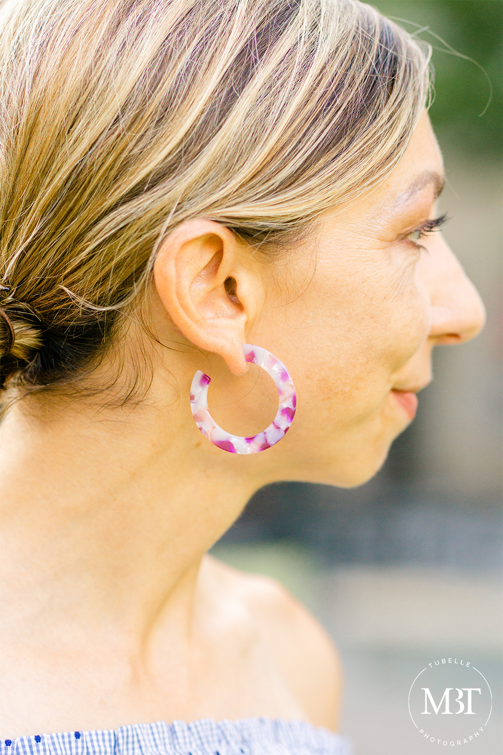 closeup of a pink fashion earrings, fashion session taken in Arlington, Virginia by a lifestyle photographer in Virginia