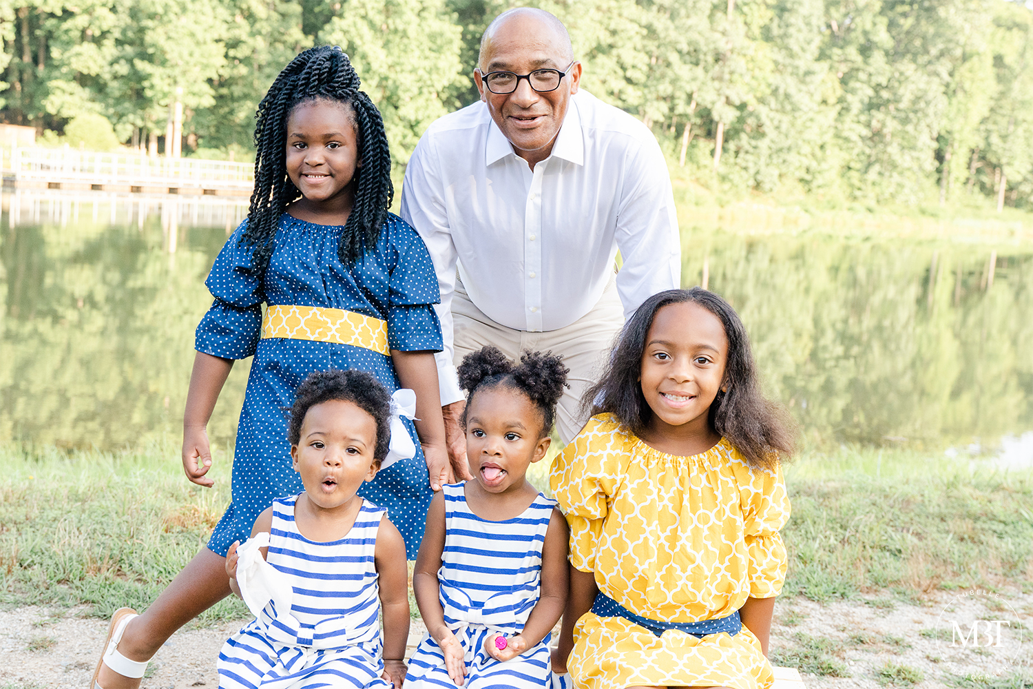 portrait of grandpa with kids, taken in Triangle, Virginia by a Virginia portrait photographer