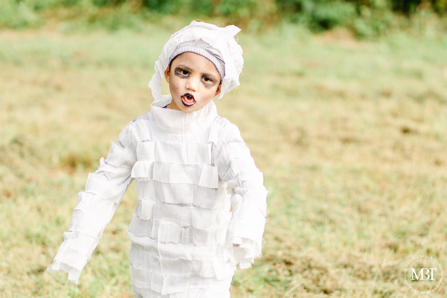 little boy wearing mummy costume at a halloween themed session in Chantilly, Virginia taken by a DMV family photographer