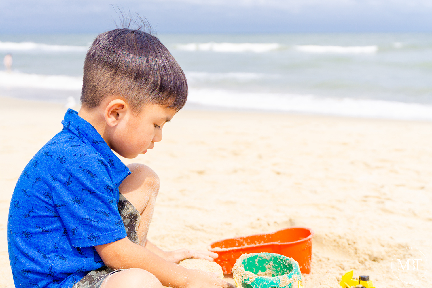 boy playing in the sand, taken in Virginia Beach by a Northern Virginia family photographer
