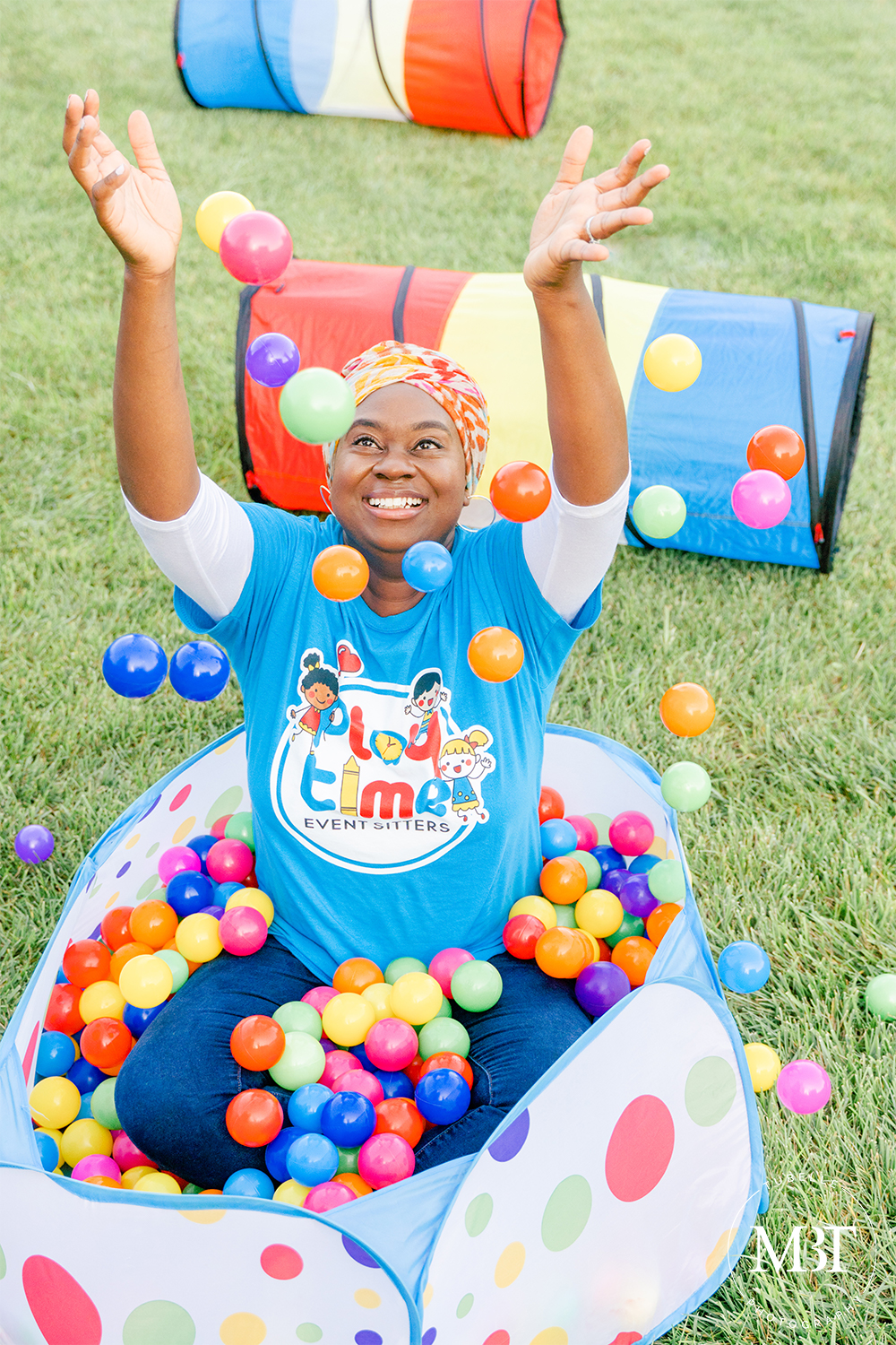 woman playing at ball pit in a personal branding session, taken in Tysons, Virginia by a DMV photographer