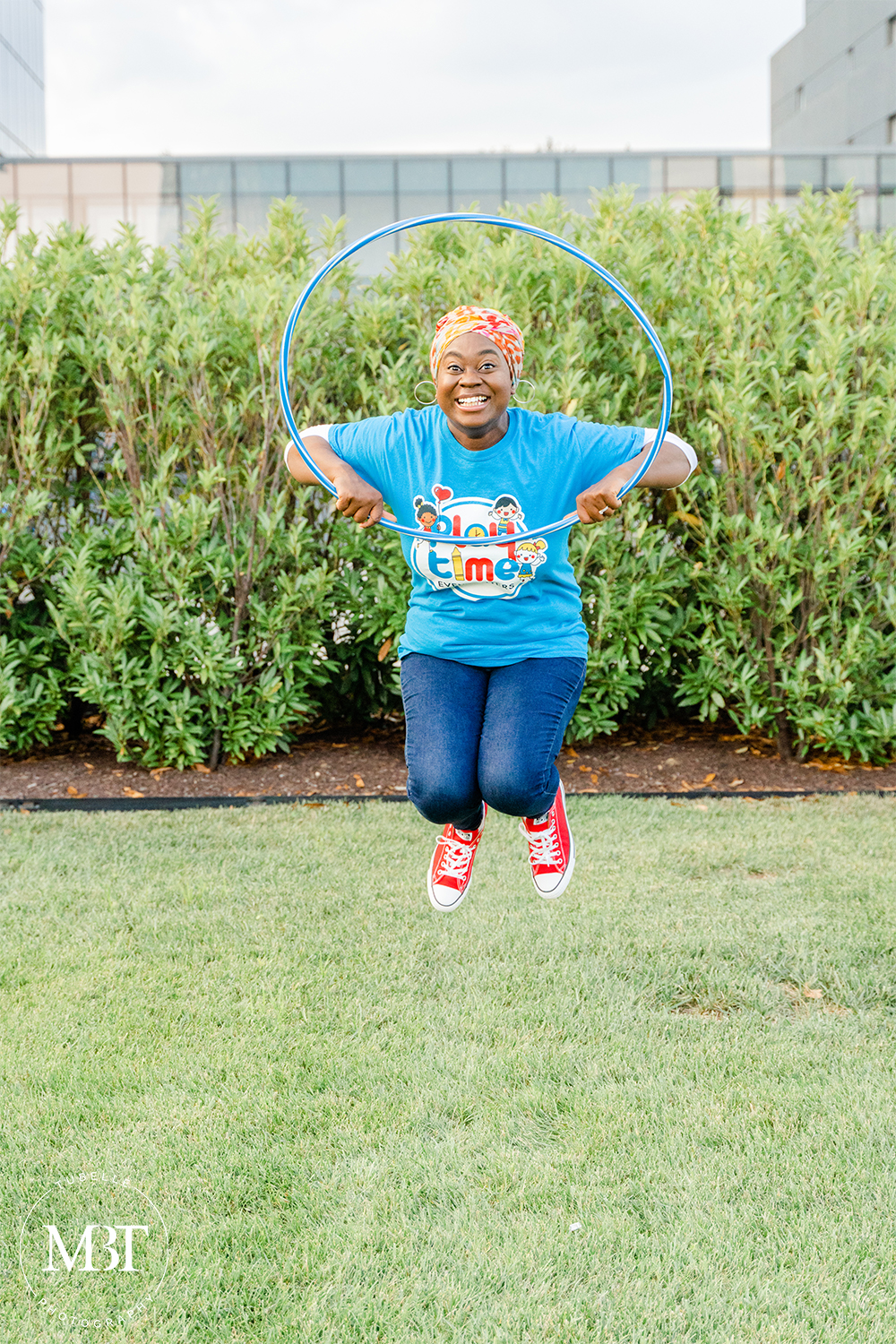 woman playing with hula hoop in a personal branding session, taken in Tysons, Virginia by a Virginia photographer