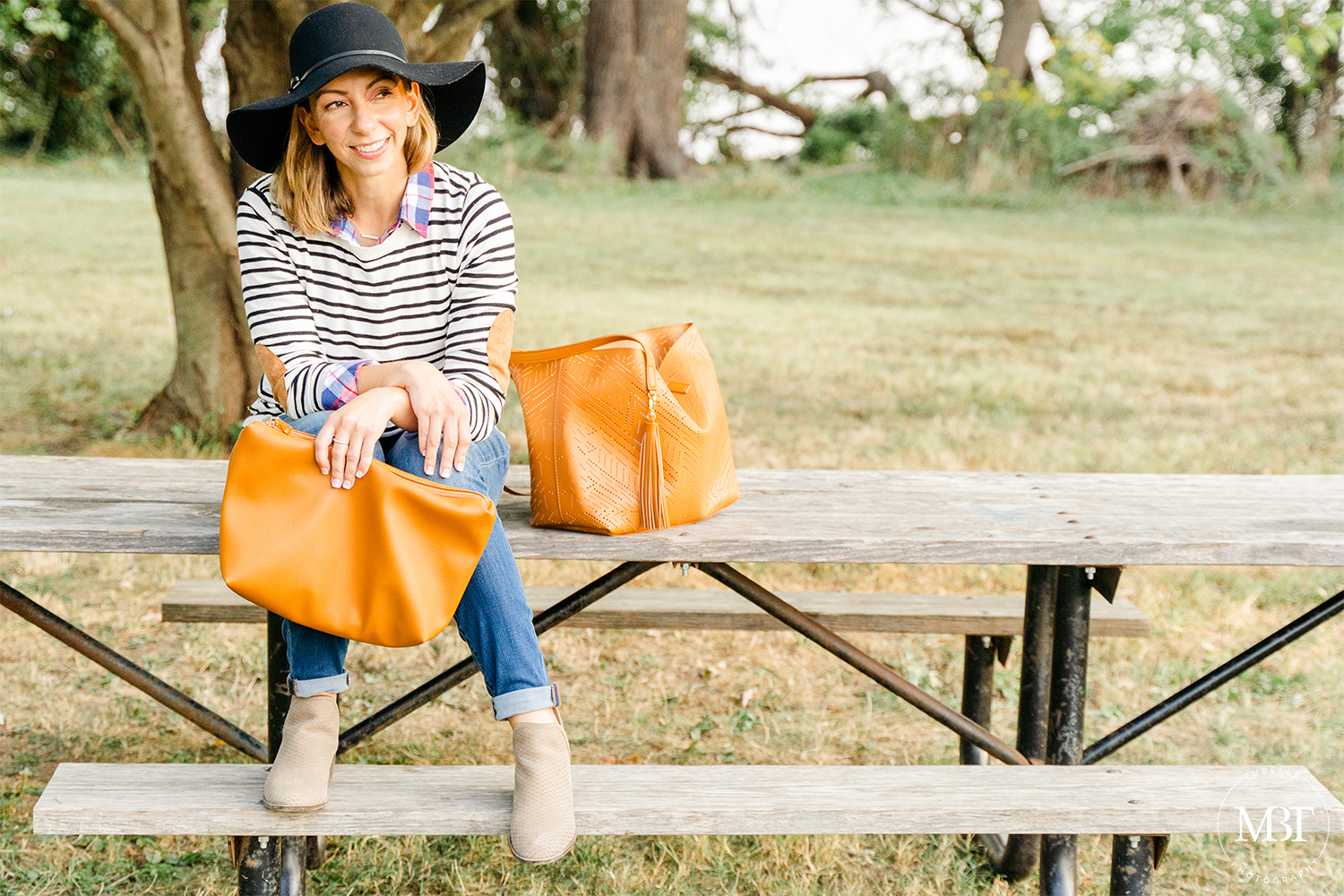 lifestyle session - fashion blogger sitting by the picnic table, taken in Alexandria, Virginia by a Northern Virginia lifestyle photographer