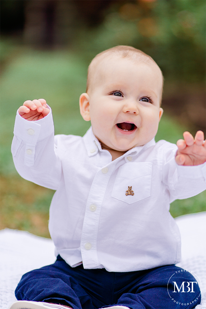 baby boy laughing during a family session at Bon Air Park in Arlington, Virginia by a Virginia baby photographer
