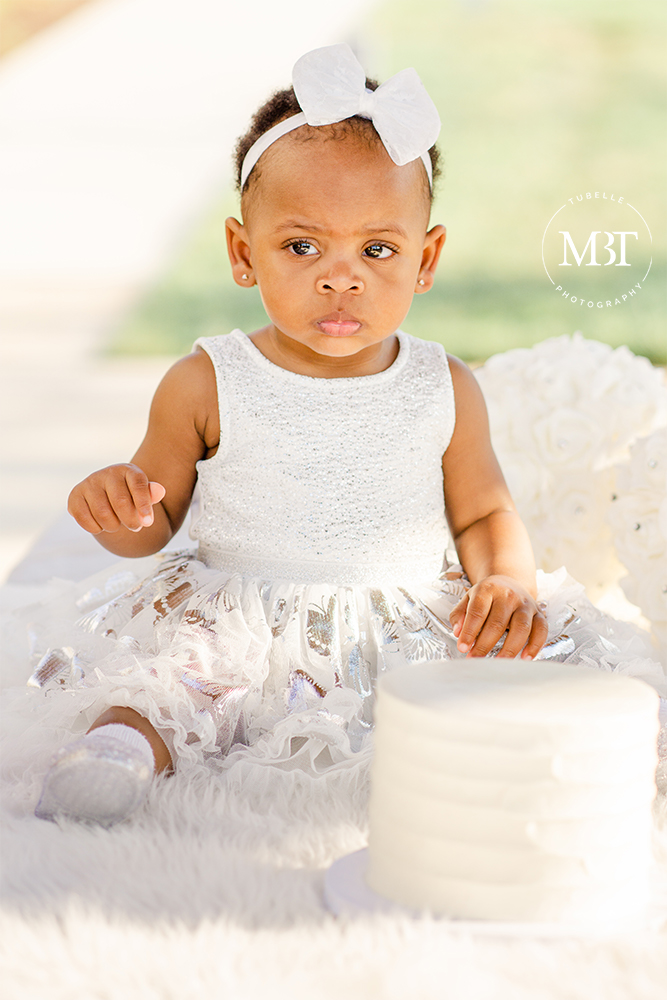 baby girl during her cake smash session in Herndon, Virginia by a Northern Virginia cake smash photographer