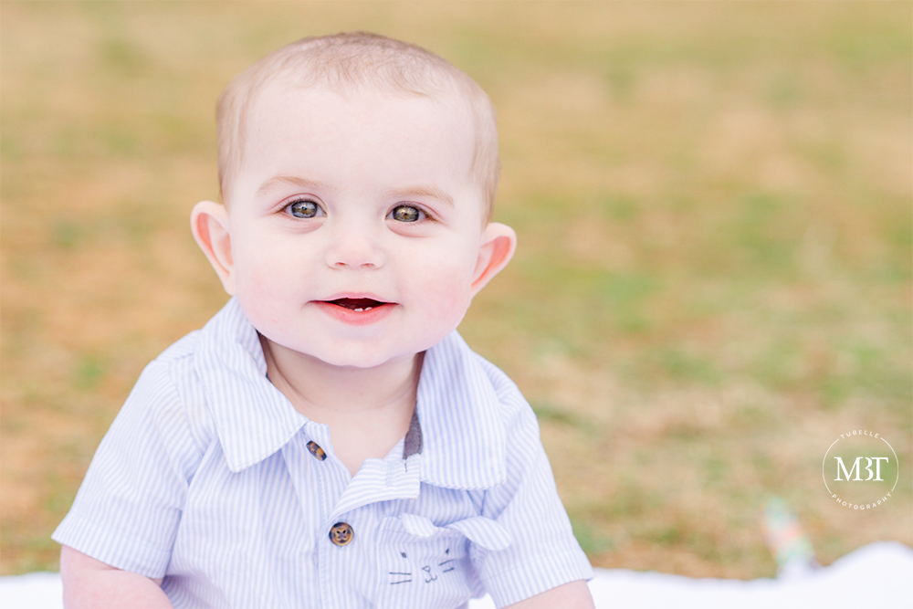 baby boy smiling during a family session in Reston, Virginia by a DMV family photographer