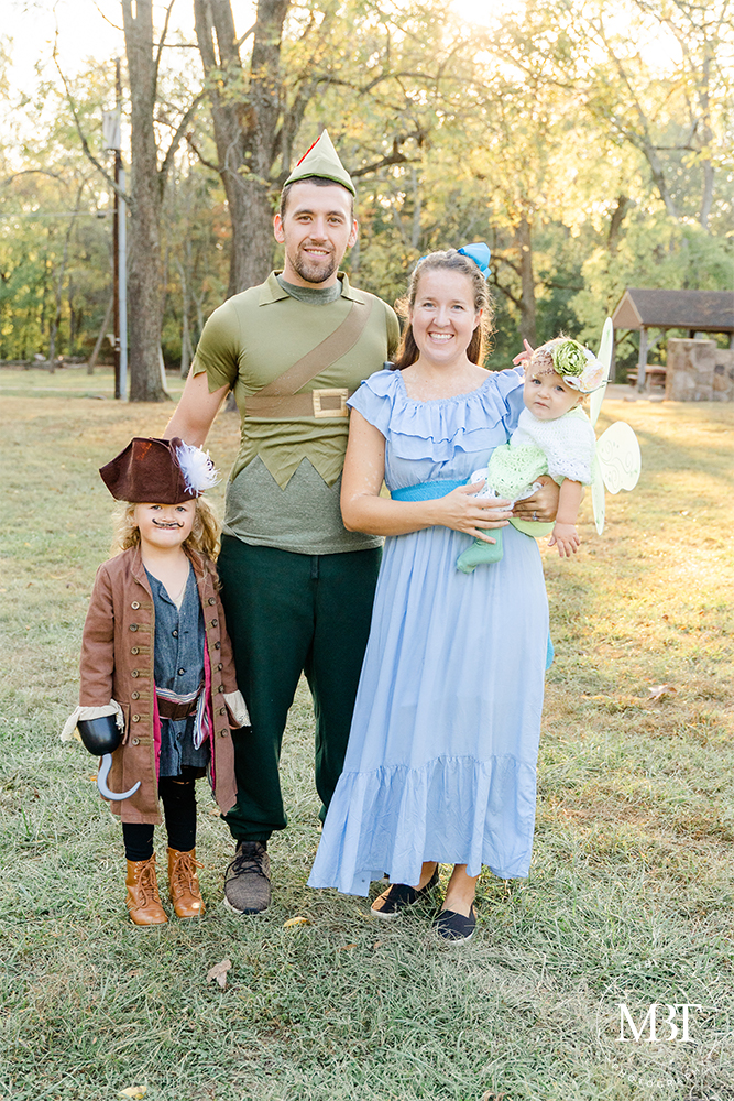 family of 4 wearing coordinating Peter Pan costumes during their Halloween session in Chantilly, Virginia by a Northern Virginia family photographer