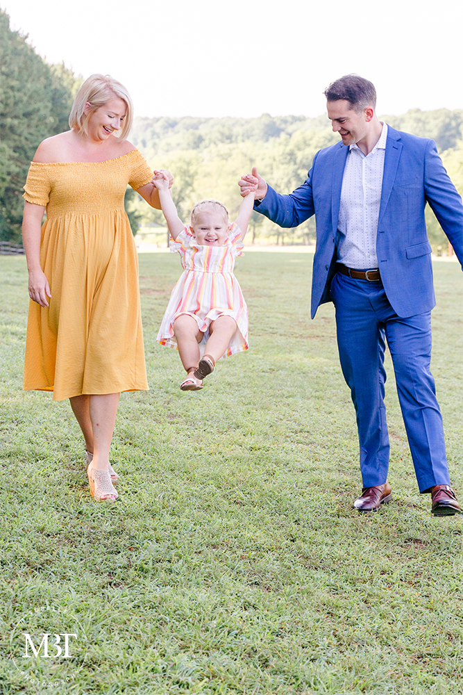 family of 3 during their family session at Lake Fairfax Park in Reston, Virginia by a Northern Virginia family photographer