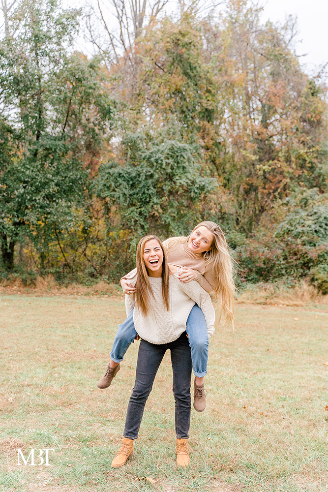 teenage girls having a good time during their senior session at Ellanor C. Lawrence Park in Chantilly, Virginia by a DMV senior photographer