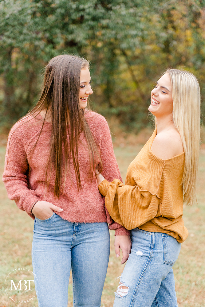 teenage girls chatting & laughing during their senior session in Leesburg, Virginia by a Northern Virginia senior photographer