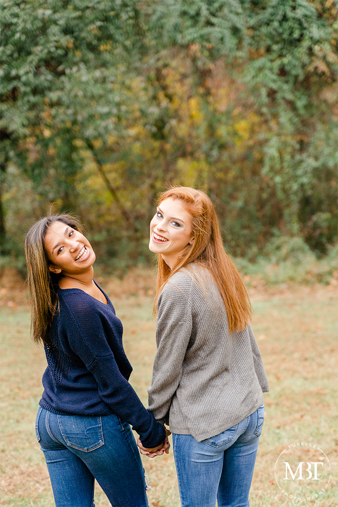teenage friends laughing during their senior session in Loudoun County Virginia by a Virginia senior photographer