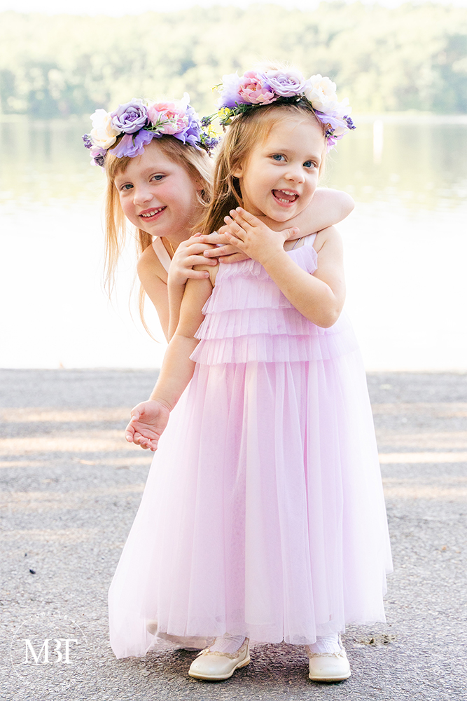 siblings playing during their family session at Burke Lake Park in Fairfax, Virginia by a NoVa family photographer
