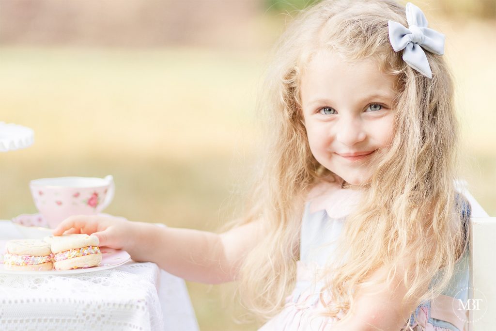 girl smiling during a family session at Ellanor Lawrence Park taken by a DMV family photographer