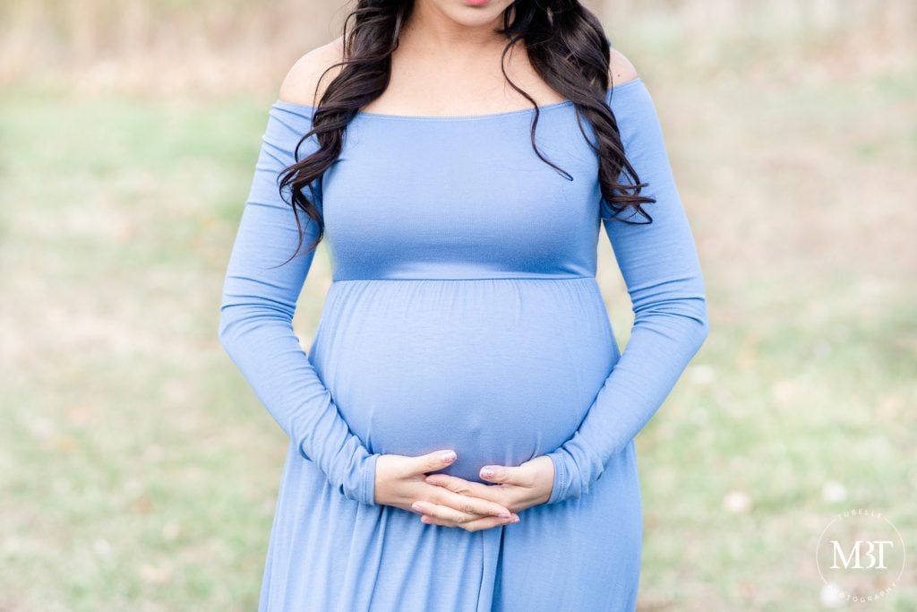 close up shot of pregnant belly during a maternity session in Gainesville, Virginia taken by a Fairfax County Virginia maternity photographer