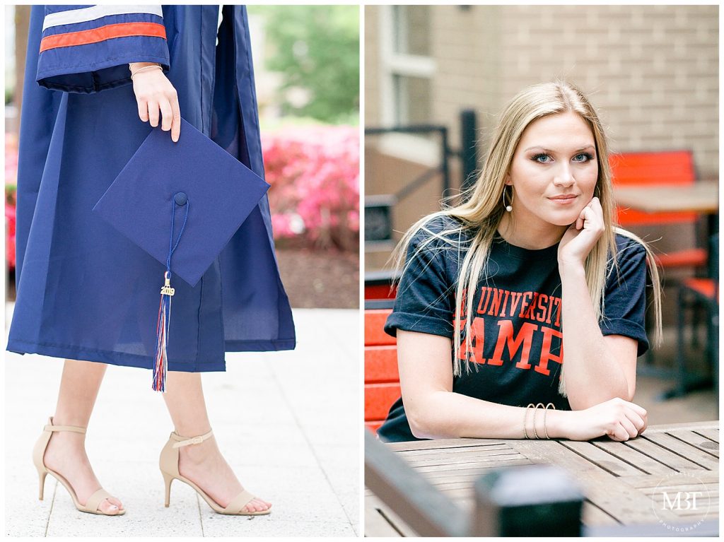 girl holding graduation cap, wearing graduation gown & University of Tampa tee during her senior session in Reston Town Center taken by a Fairfax County Virginia senior photographer