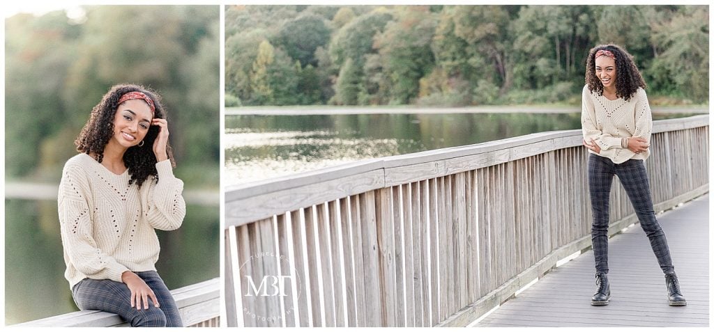 girl sitting & laughing on the bridge during her senior photo shoot at Lake Fairfax Park in Reston, Virginia taken by TuBelle Photography, a Northern Virginia senior photographer