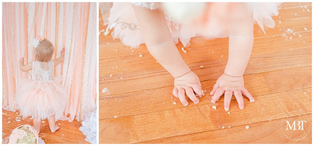 baby girl playing during her cake smash pictures in Gainesville, Virginia by TuBelle Photography, a Northern Virginia cake smash photographer