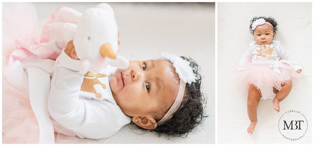 baby girl playing with a lovie during milestone photo shoot in Woodbridge, Virginia, taken by TuBelle Photography, a NoVa milestone photographer