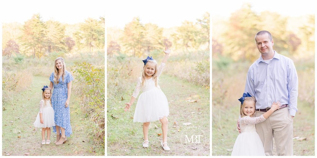 Little girl strikes a pose and cuddles close to mom and dad for their fall minis taken by TuBelle Photography, a DMV Photographer.