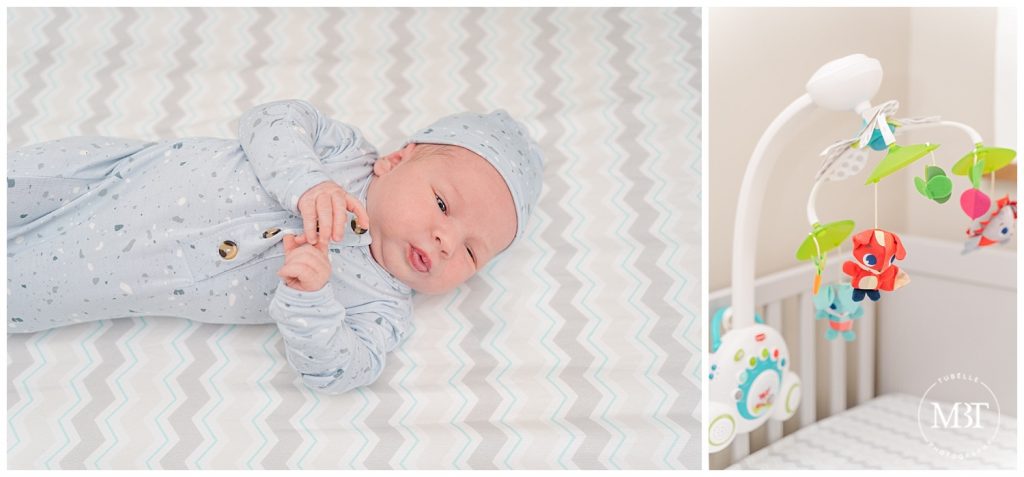 Baby boy in blue lying in crib and baby mobile at these Fairfax County Virginia Newborn Photos taken by TuBelle Photography, a Northern VA newborn photographer.