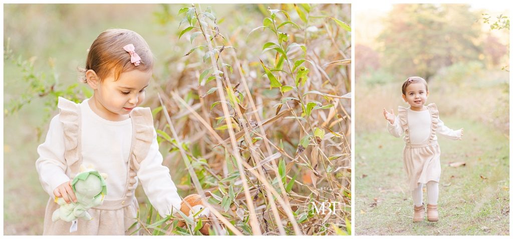 Baby girl playing with stuffed animals in tall grass at her fall mini session. Taken by TuBelle Photography, a Northern Virginia Photographer.