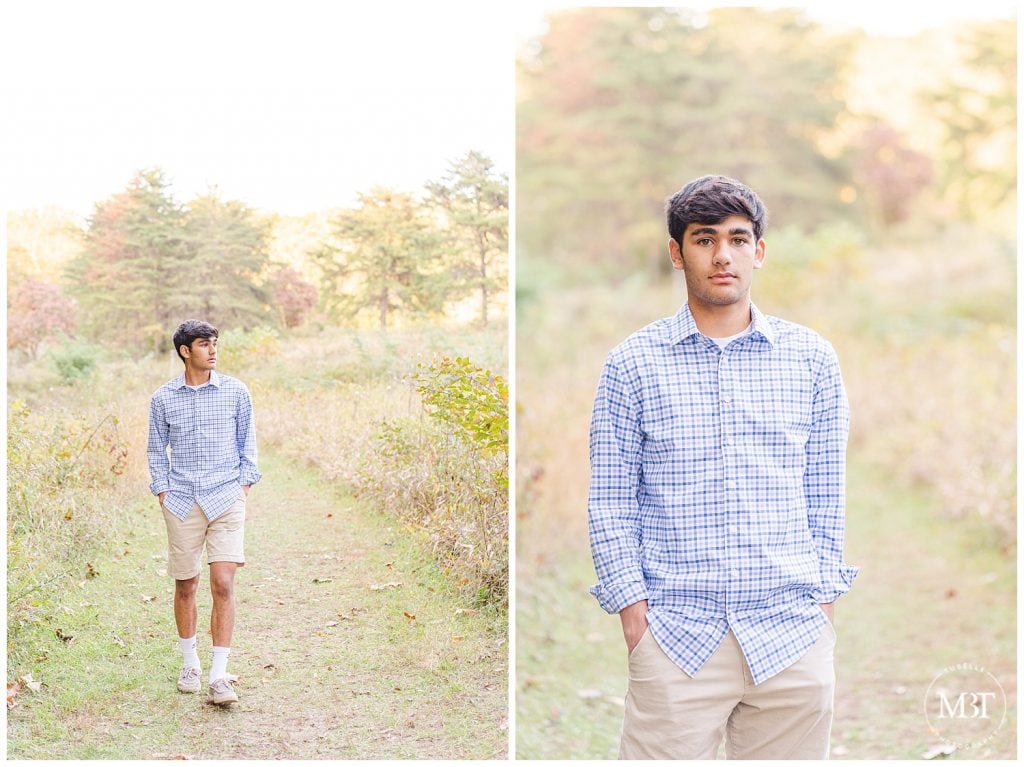 Senior boy looking out into field at his fall minis taken by TuBelle Photography, a DMV Photographer.