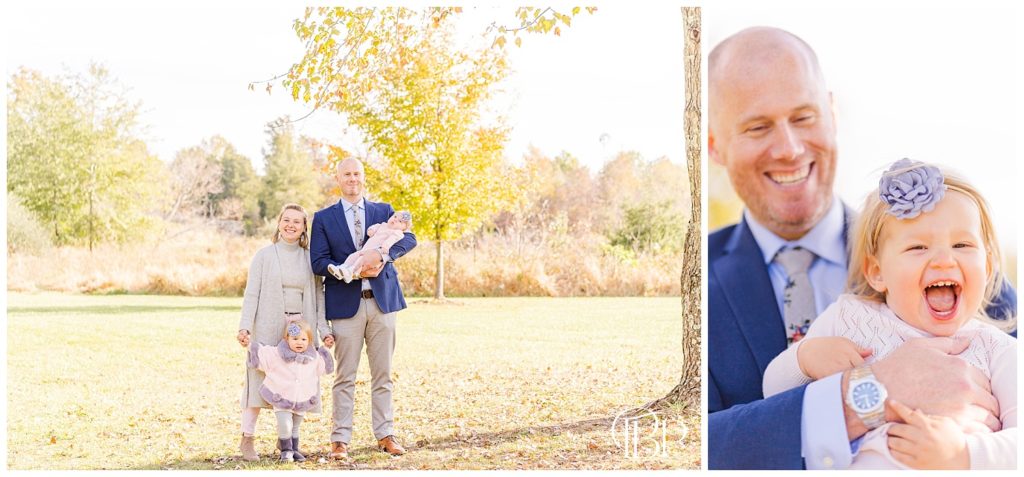 Mom and Dad holding daughters and smiling for fall mini session in Sterling, Virginia. Taken by TuBelle Photography, a NoVa Photographer.