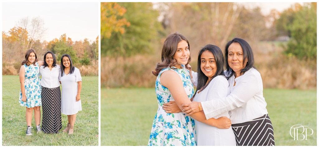 Mom wraps arm around grown daughters for their fall mini session in Northern Virginia. Taken by TuBelle Photography, a Loudon County Virginia photographer.