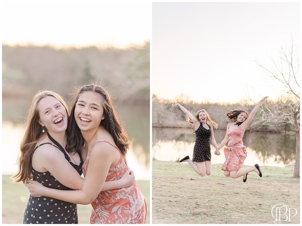 Senior girl holding hands and jumping in the air with her best friend for her Claude Moore Park senior photos taken by TuBelle Photography, a Loudon County, Virginia Senior Photographer.