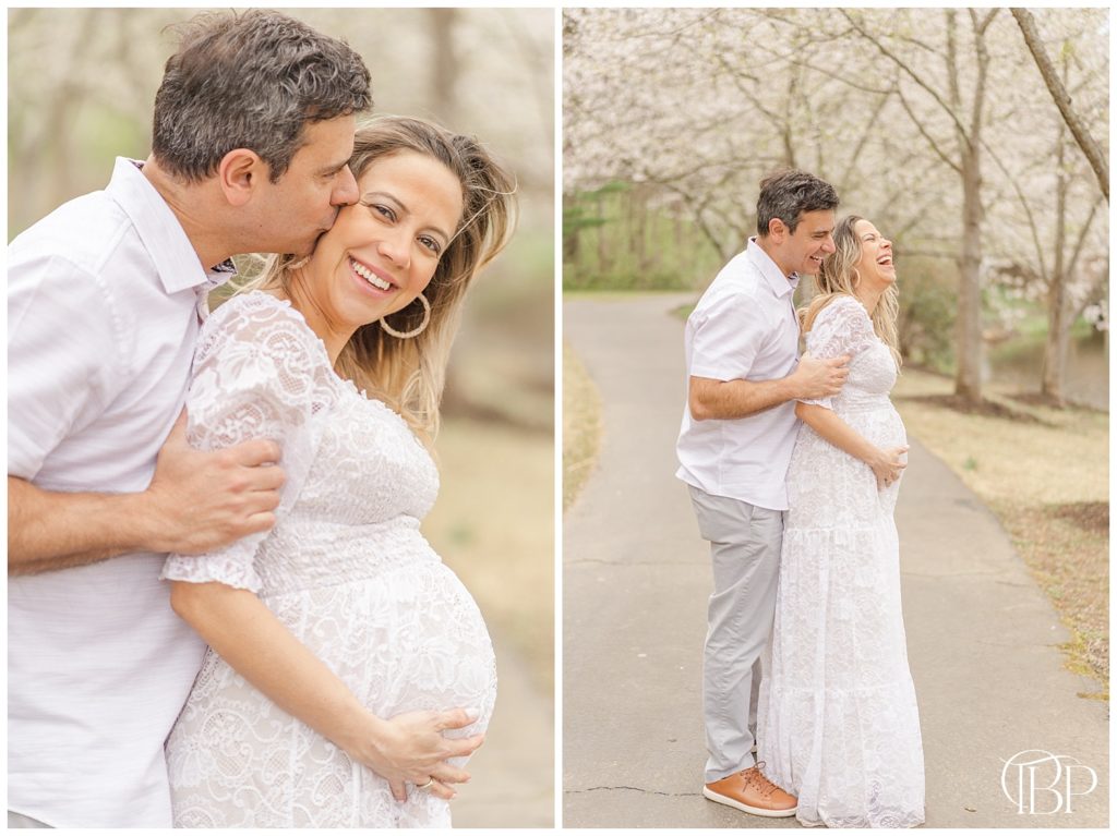 Dad standing behind expecting mom, kissing her head for their maternity session at Meadowlark Botanical Gardens in Vienna, VA. Taken by TuBelle Photography, a Northern Virginia maternity photographer.