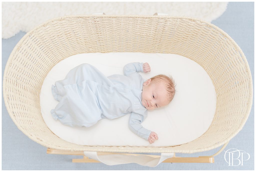 Baby boy in bassinet for nursery newborn photos taken by TuBelle Photography, a newborn photographer in Alexandria, VA.