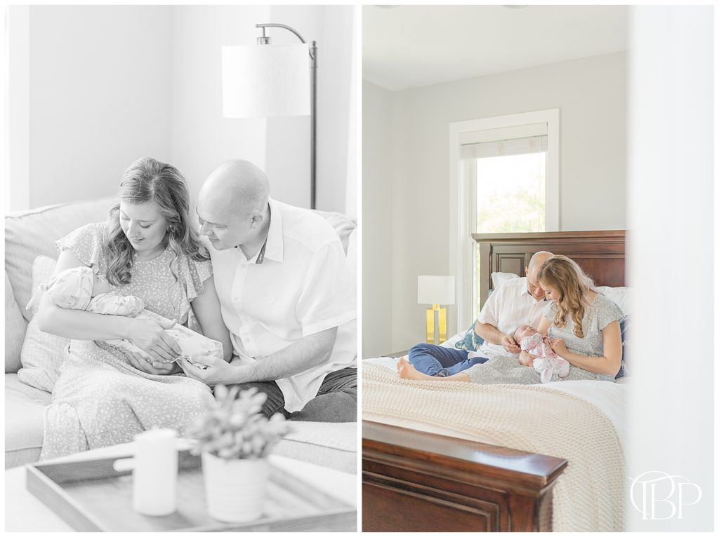 Mom and Dad sitting together on the bed, admiring their newborn baby girl for their lifestyle newborn photography taken by TuBelle Photography, a Centreville, VA newborn photographer.