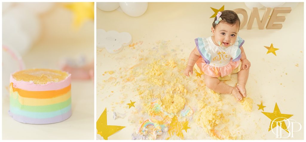 Baby girl sitting in the floor with cake smash mess and close up photo of rainbow cake for cake smash session in Fairfax County, Virginia. Taken by TuBelle Photography, a cake smash photographer.