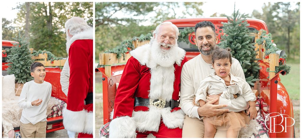 baby crying with Santa and dad during red truck mini session in NoVa