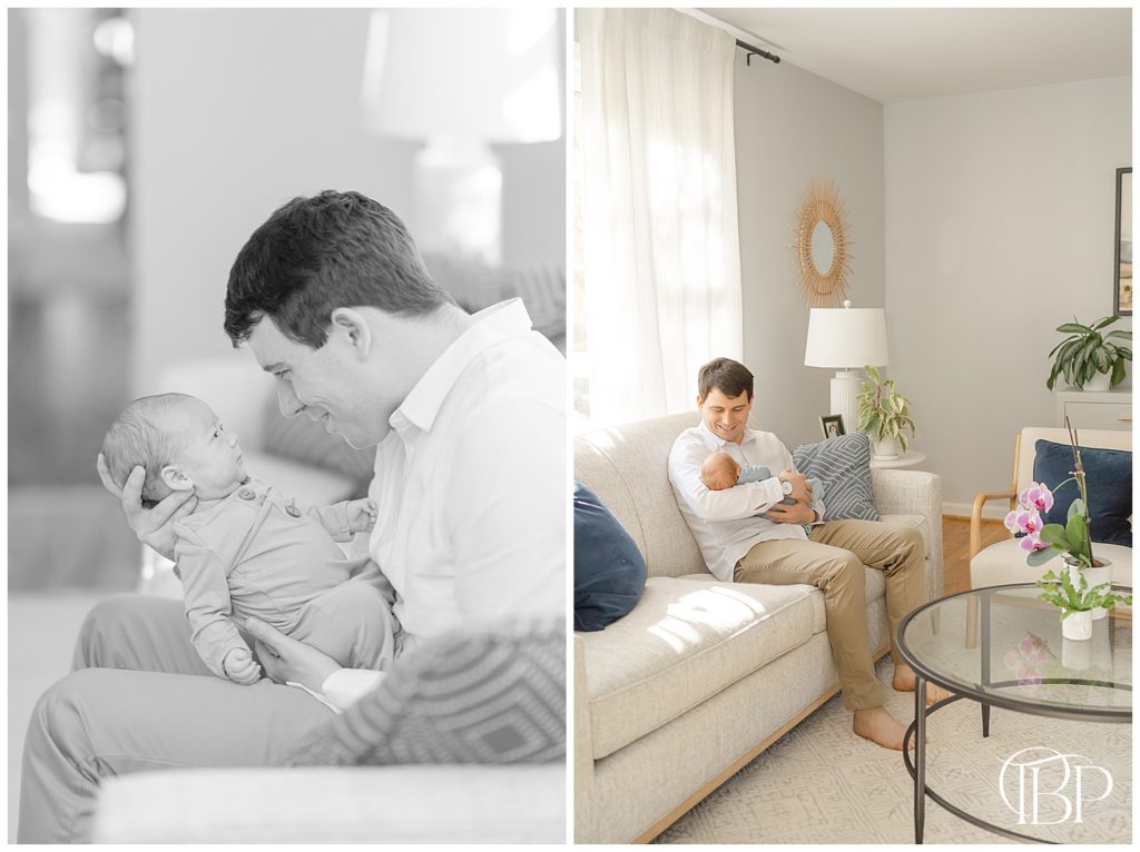 dad admiring baby boy in the living room during in home newborn photos in Arlington, Virginia