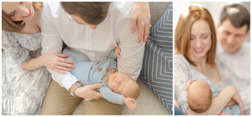 baby stretching while being held by parents during in home newborn photography in Arlington, Virginia
