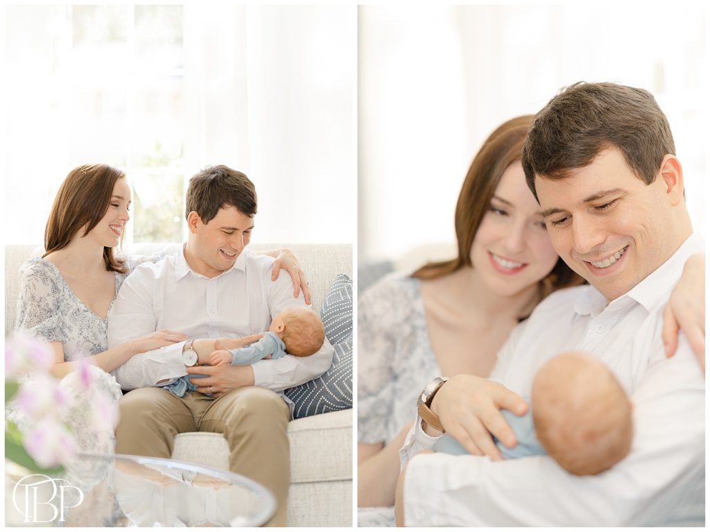 parents in the living room admiring baby boy during in home newborn pictures in Arlington, Virginia