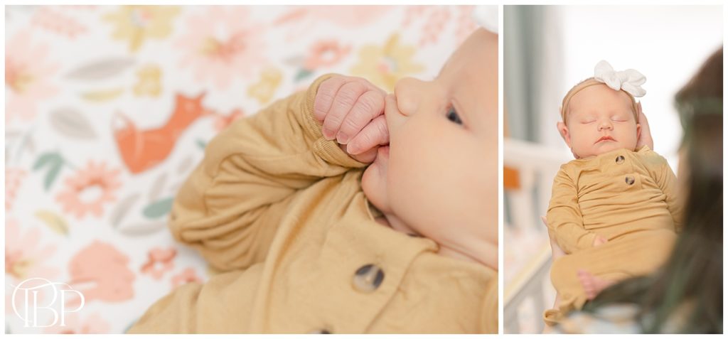 Baby girl playing with her hand during lifestyle newborn session in Haymarket, Virginia