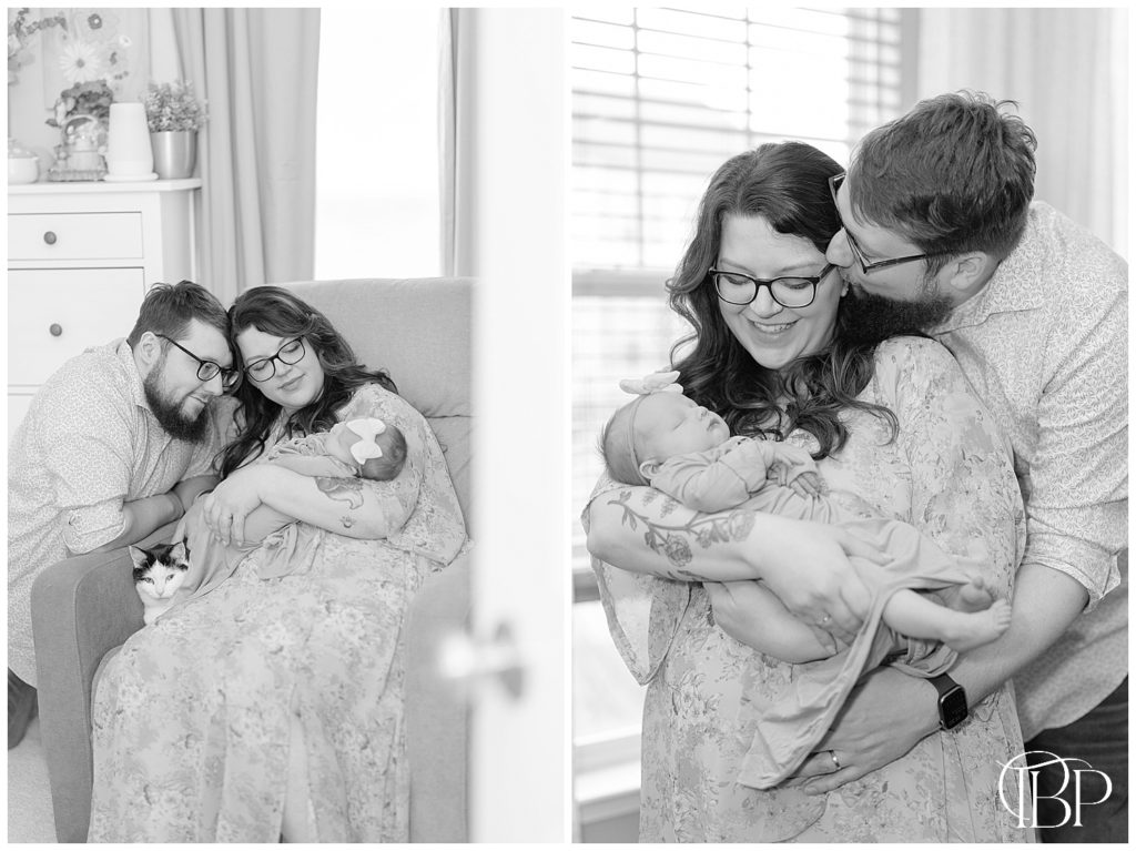 Dad kissing mom while holding baby during their lifestyle newborn session in Haymarket, VA