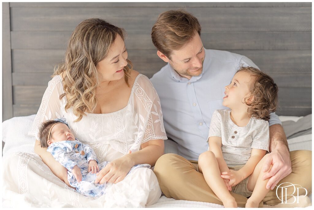 Family interacting during Centreville, Virginia in home newborn session
