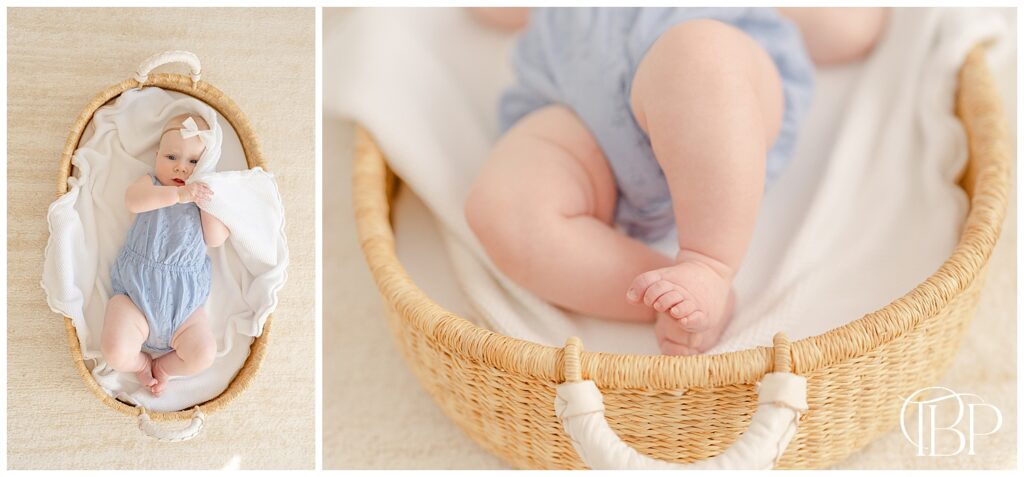 Baby in a bassinet playing during 6 month pictures