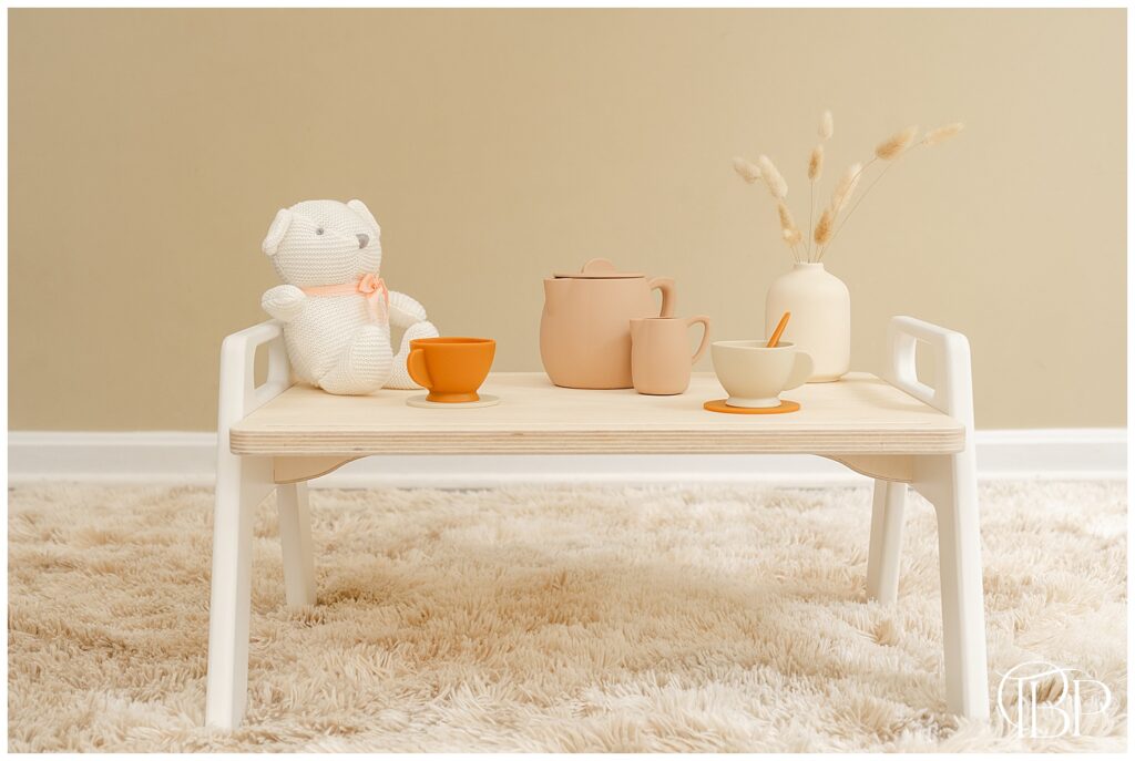 Tea set and teddy bear on a Montessori inspired play tray