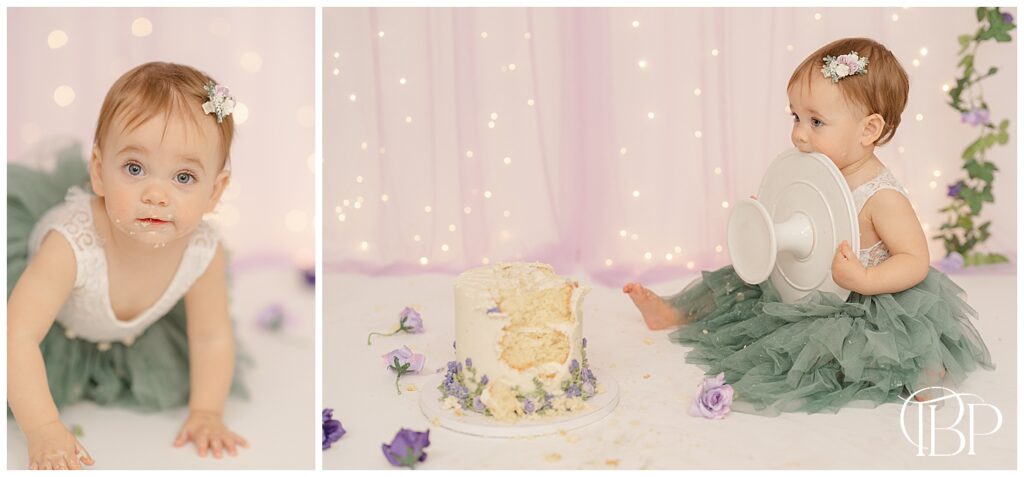 Baby girl eating cake stand during studio cake smash photos in Bristow, VA