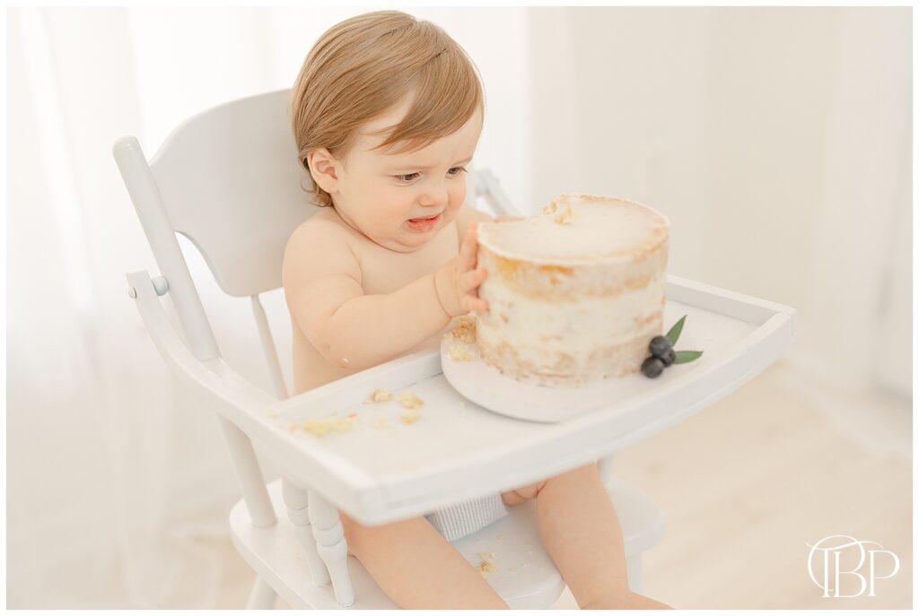 Baby doesn't like cake during simple cake smash session in Ashburn, VA