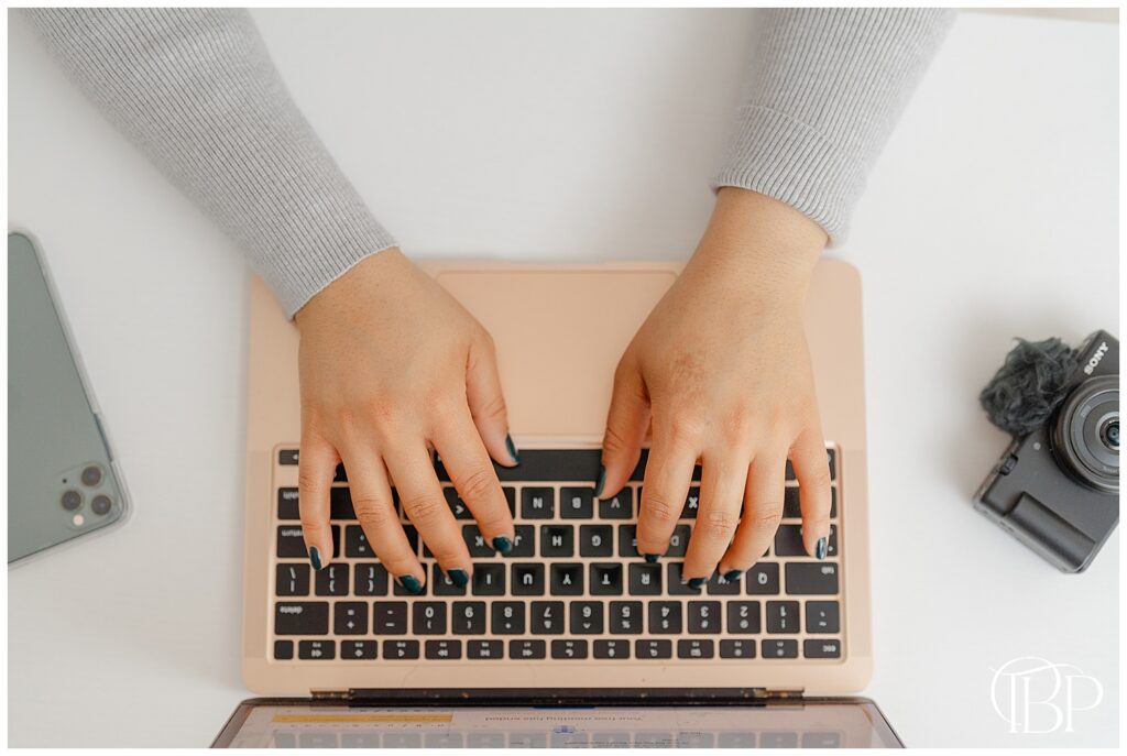 Typing on a computer taken by a branding photographer in Sterling, VA