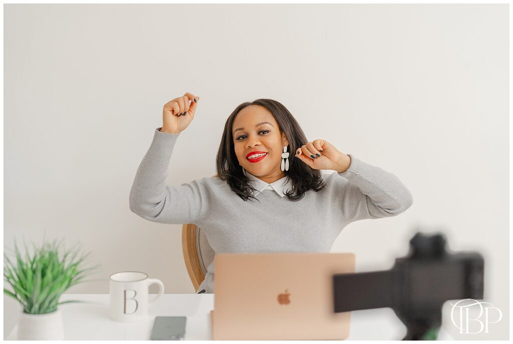 Woman celebrating while filming during branding photos in Sterling, VA