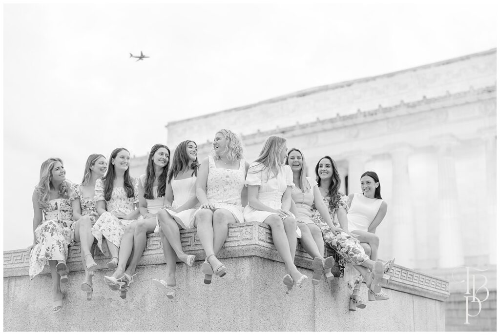 Friends laughing in front of Lincoln Memorial